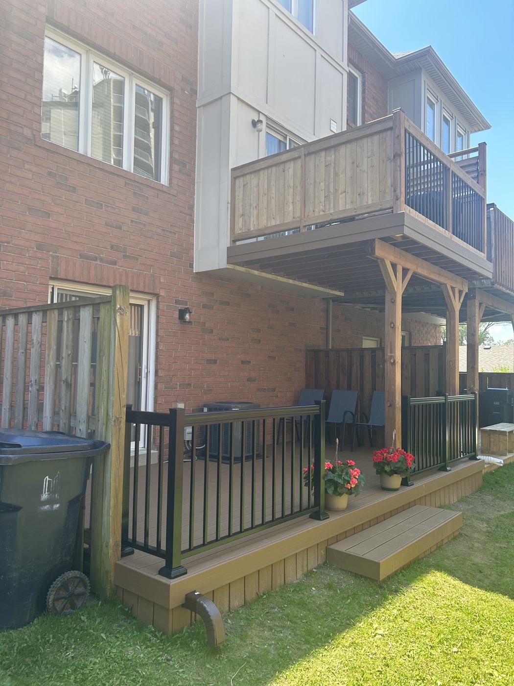 Elevated wood deck with black aluminum railing