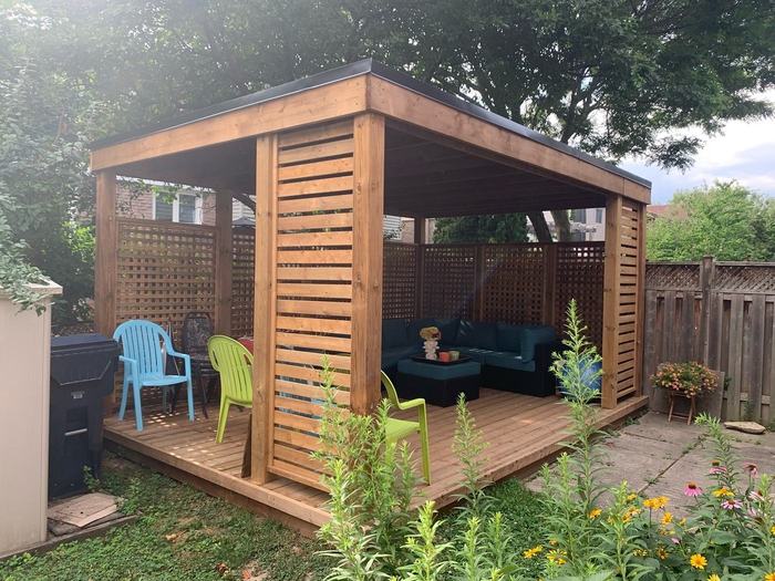 Cedar roof structure with lattice privacy walls and gazebo styling